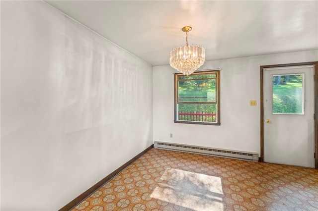 empty room featuring a baseboard heating unit and an inviting chandelier