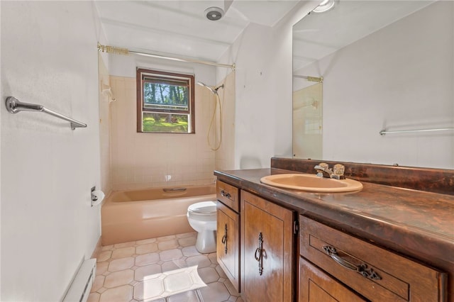 full bathroom featuring tiled shower / bath, toilet, and vanity