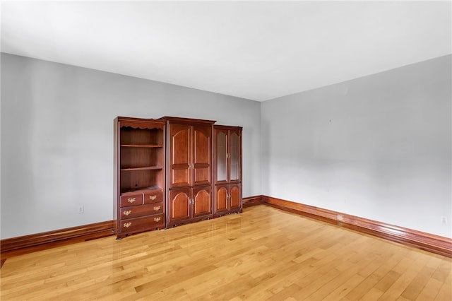 unfurnished bedroom with light wood-type flooring