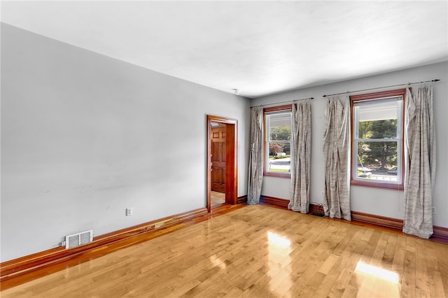 spare room featuring light wood-type flooring