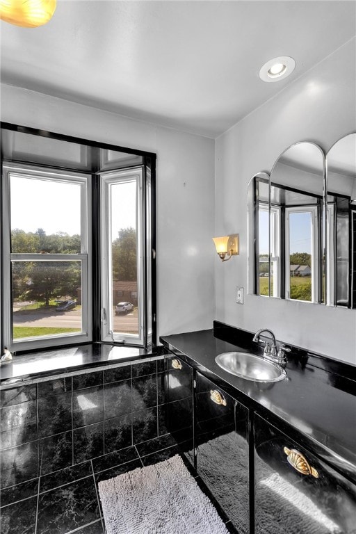 bathroom with a wealth of natural light and vanity