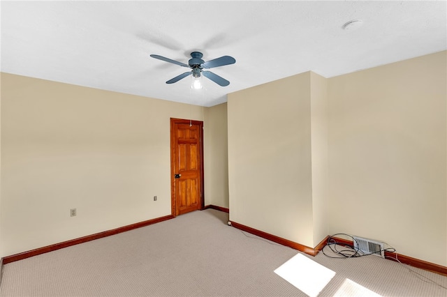 carpeted empty room with ceiling fan