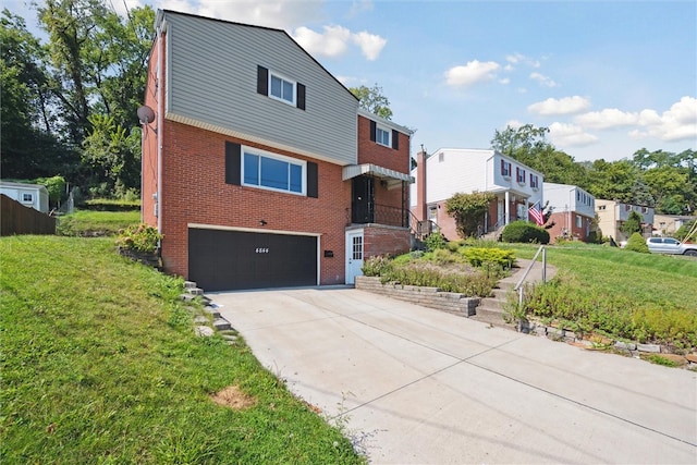 view of front of property featuring a garage and a front yard