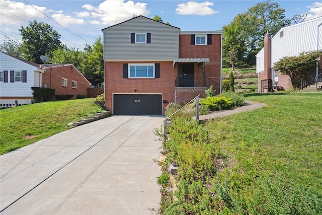 view of front of home featuring a garage and a front lawn