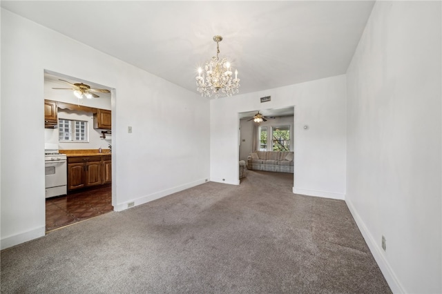 interior space featuring ceiling fan with notable chandelier and sink