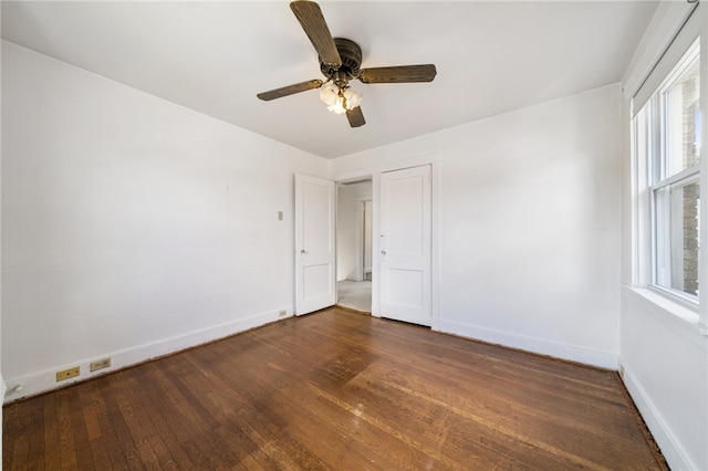 interior space featuring ceiling fan and dark hardwood / wood-style floors