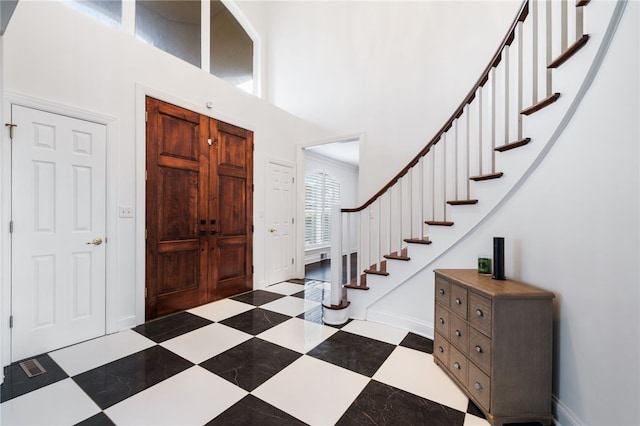 foyer entrance with a high ceiling