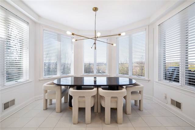 dining space featuring a healthy amount of sunlight and light tile patterned floors