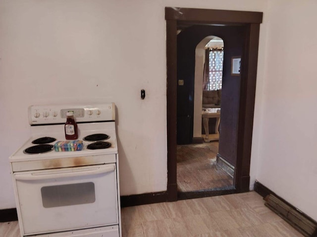 kitchen featuring light hardwood / wood-style flooring and white electric range