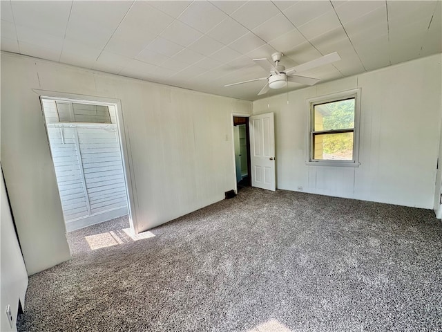 unfurnished bedroom featuring ceiling fan and carpet flooring