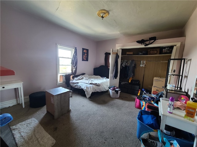 carpeted bedroom featuring a closet