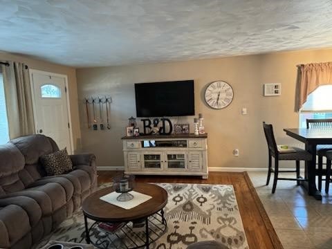 tiled living room with a textured ceiling