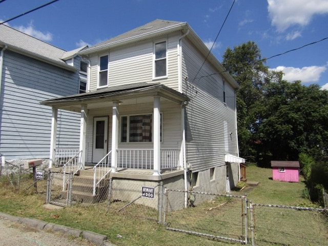 view of front of house featuring a front lawn and a porch