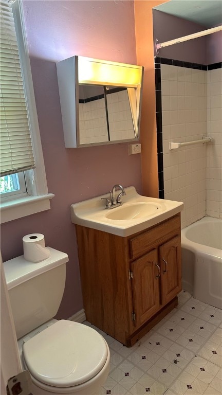 full bathroom featuring shower / bathing tub combination, vanity, and toilet