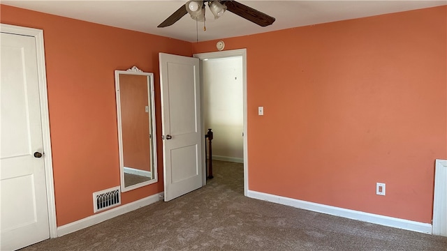 unfurnished bedroom with carpet flooring and ceiling fan