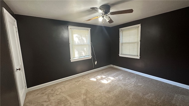 unfurnished room with ceiling fan and carpet floors