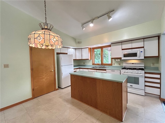 kitchen featuring pendant lighting, white appliances, sink, a center island, and white cabinets