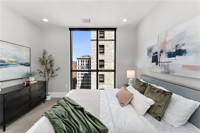 bedroom featuring light carpet