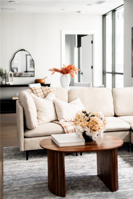 unfurnished living room featuring wood-type flooring and expansive windows