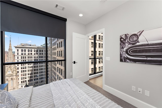 bedroom featuring hardwood / wood-style floors