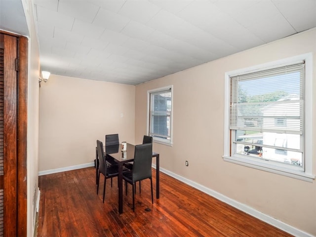 dining area featuring dark hardwood / wood-style floors