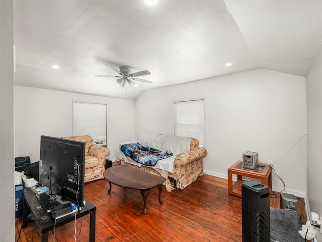 living room featuring lofted ceiling, ceiling fan, and wood-type flooring