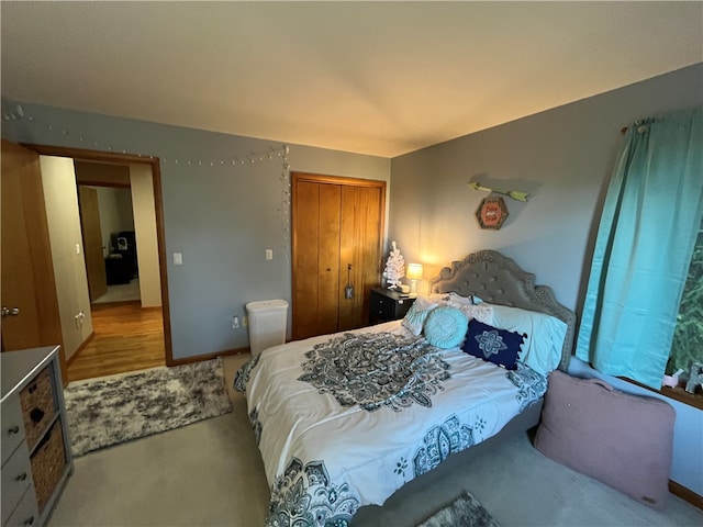 bedroom with light hardwood / wood-style flooring and a closet