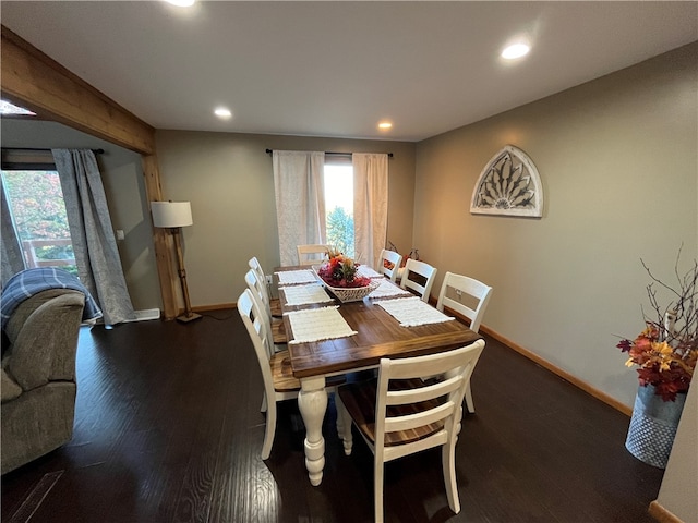 dining area featuring dark wood-type flooring