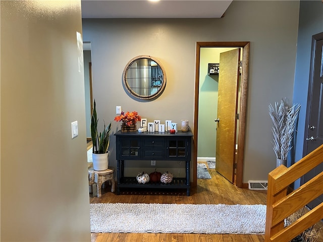 interior space with vanity and hardwood / wood-style floors