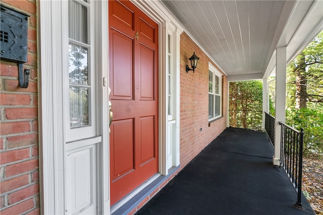 doorway to property featuring covered porch