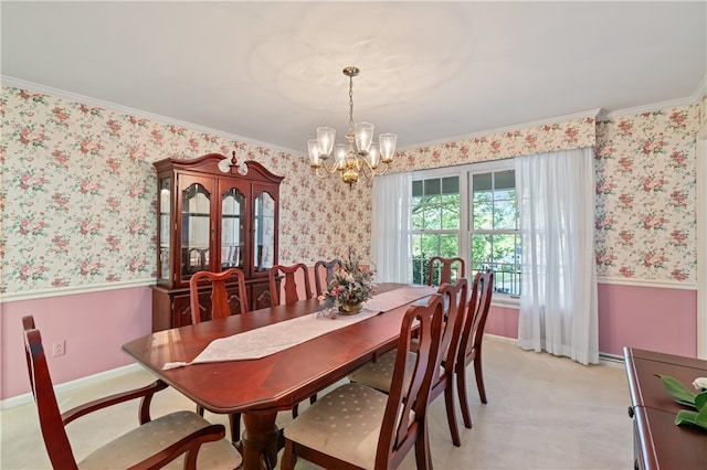 dining area featuring light colored carpet, an inviting chandelier, and crown molding