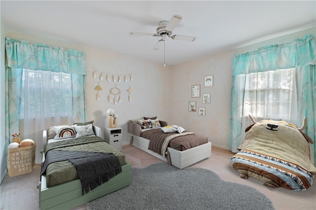 carpeted bedroom featuring ceiling fan