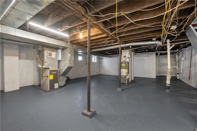 basement featuring heating unit and gas water heater