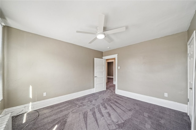 carpeted empty room featuring ceiling fan