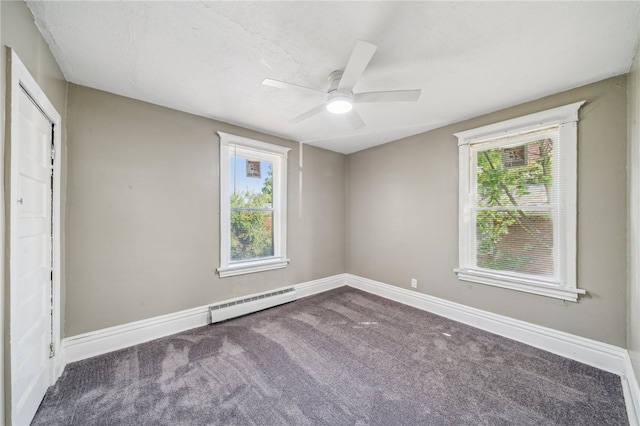 unfurnished bedroom featuring a baseboard radiator, ceiling fan, and dark colored carpet