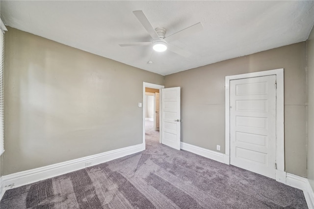 unfurnished bedroom featuring ceiling fan and carpet flooring