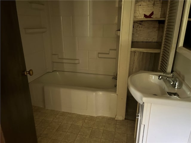 bathroom featuring shower / bathtub combination, tile patterned flooring, and vanity