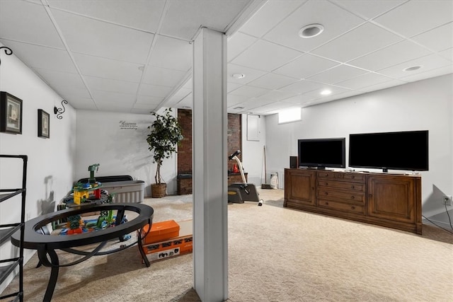 interior space featuring a paneled ceiling and carpet