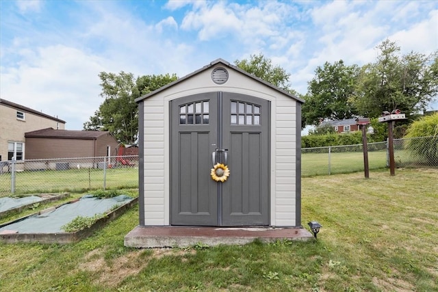 view of outbuilding with a lawn