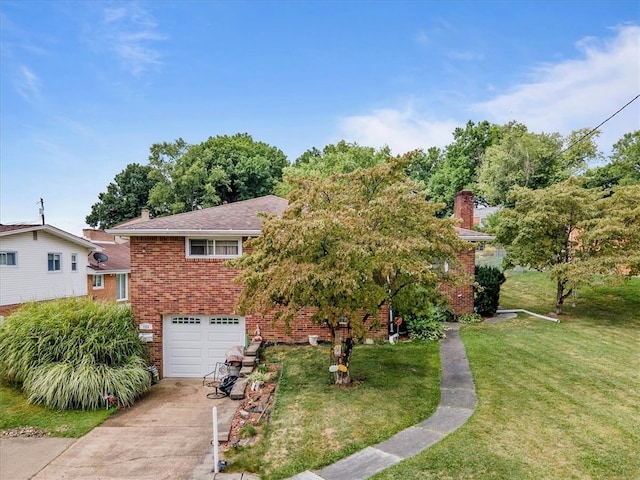 view of front of home with a garage and a front lawn