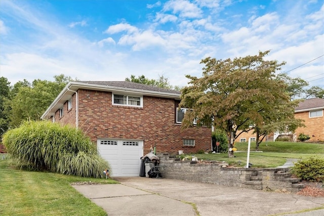 view of side of home with a yard and a garage