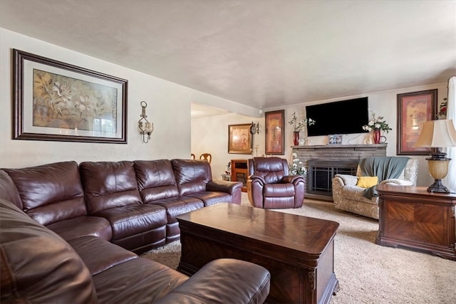 living room featuring light colored carpet and a fireplace