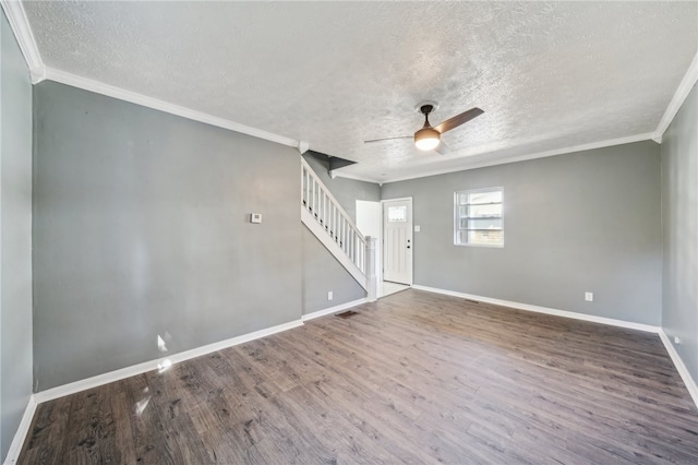 spare room featuring a textured ceiling, ceiling fan, ornamental molding, and hardwood / wood-style flooring