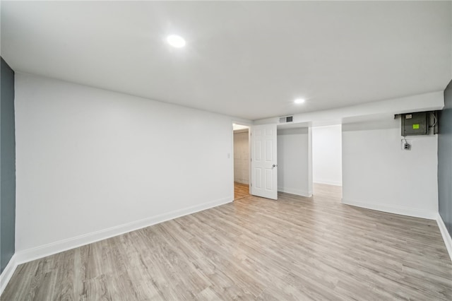 basement featuring light hardwood / wood-style flooring