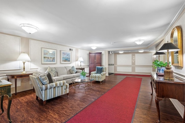 living room with ornamental molding and dark hardwood / wood-style floors