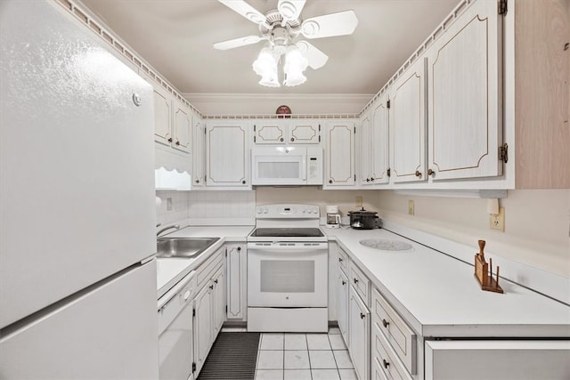 kitchen featuring white appliances, light tile patterned floors, sink, ceiling fan, and white cabinets