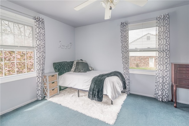 carpeted bedroom featuring ceiling fan