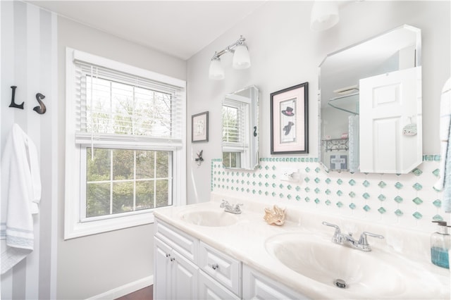 bathroom with vanity and a healthy amount of sunlight