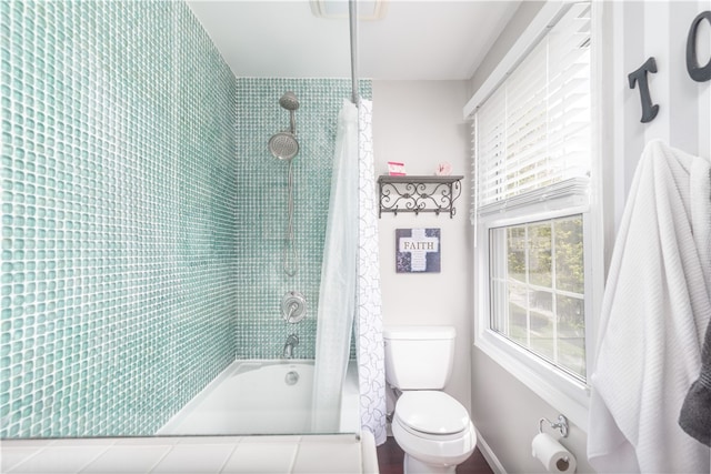 bathroom with toilet and shower / bathtub combination with curtain