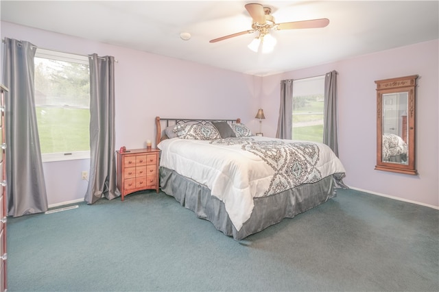 bedroom with ceiling fan and carpet floors